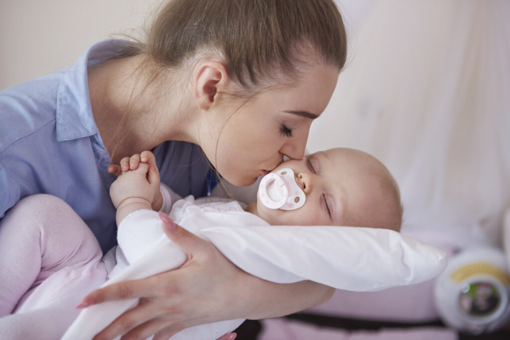 Gently rousing baby before a habitual wake using the rouse to sleep method